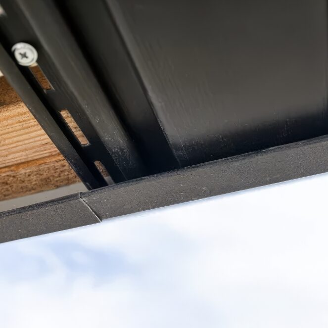 underneath view of black soffit with fastener